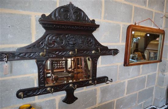 A Victorian inlaid rosewood overmantel mirror, W.84cm, together with a later Flemish carved oak hanging mirrored coat rack, W.114cm